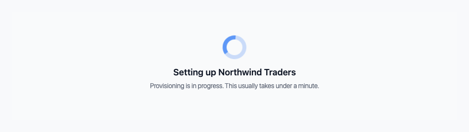 The waiting room: "Setting up Northwind Traders — provisioning is in progress. This usually takes under a minute."